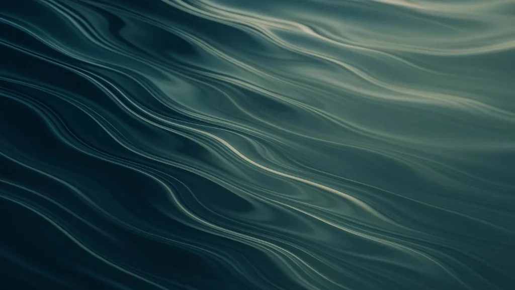 Abstract image of gentle waves in water, with smooth, flowing lines and shades of green and blue. The surface has a glossy, reflective appearance.